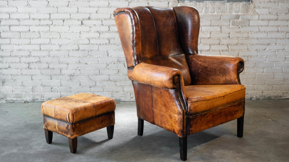 1970s Vintage Art Deco Distressed Cognac Leather Wingback Chair & Ottoman