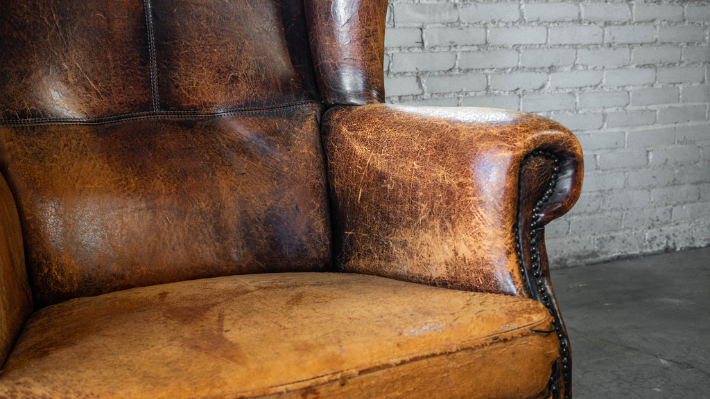 1970s Vintage Art Deco Distressed Cognac Leather Wingback Chair & Ottoman