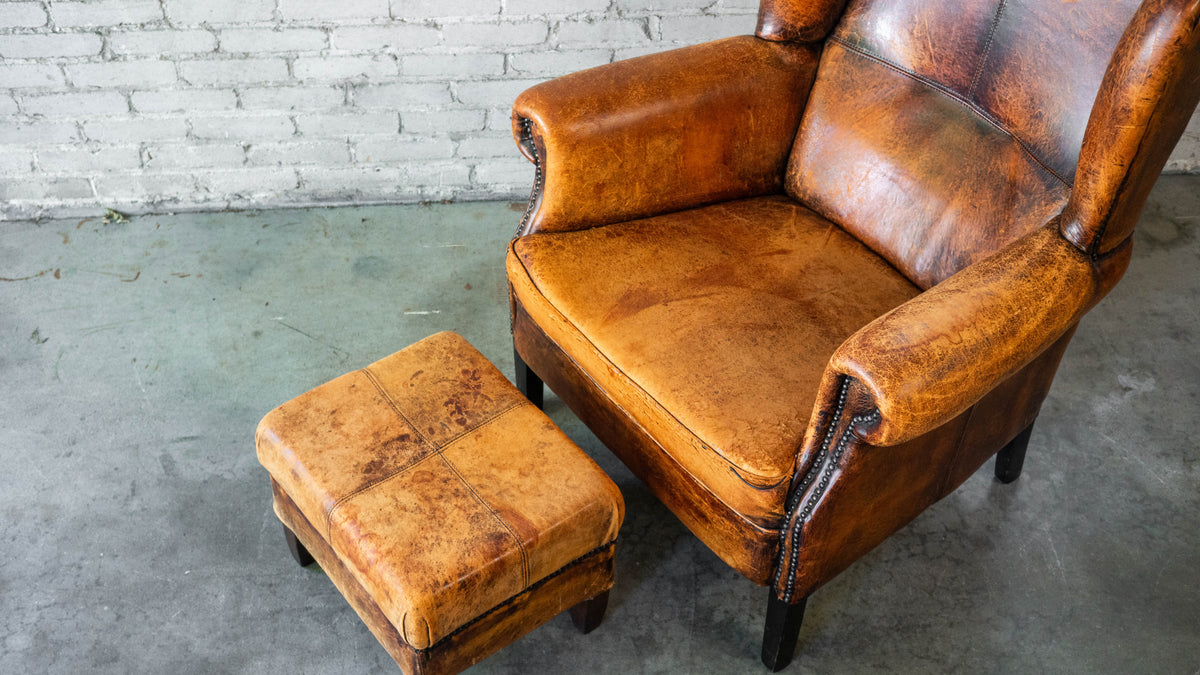 1970s Vintage Art Deco Distressed Cognac Leather Wingback Chair & Ottoman