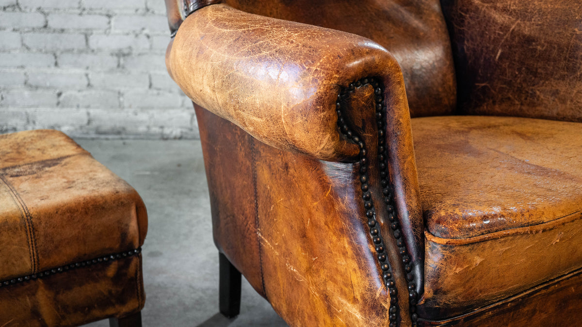 1970s Vintage Art Deco Distressed Cognac Leather Wingback Chair & Ottoman